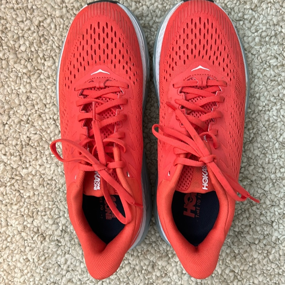 HOKA Clifton 7 tennis shoes. See photos for condition. Orange. Size 9.